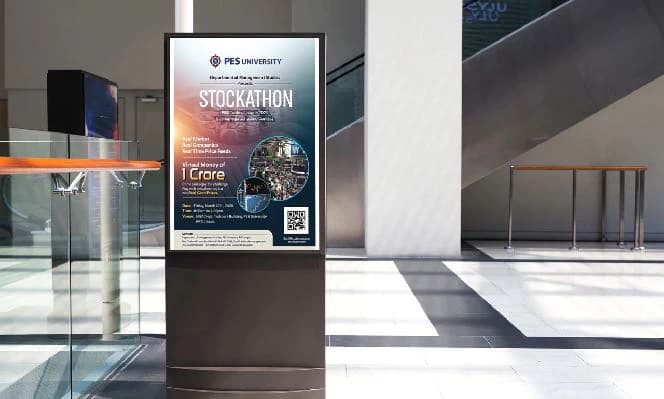 The Stockathon poster on a digital standee in a campus lobby