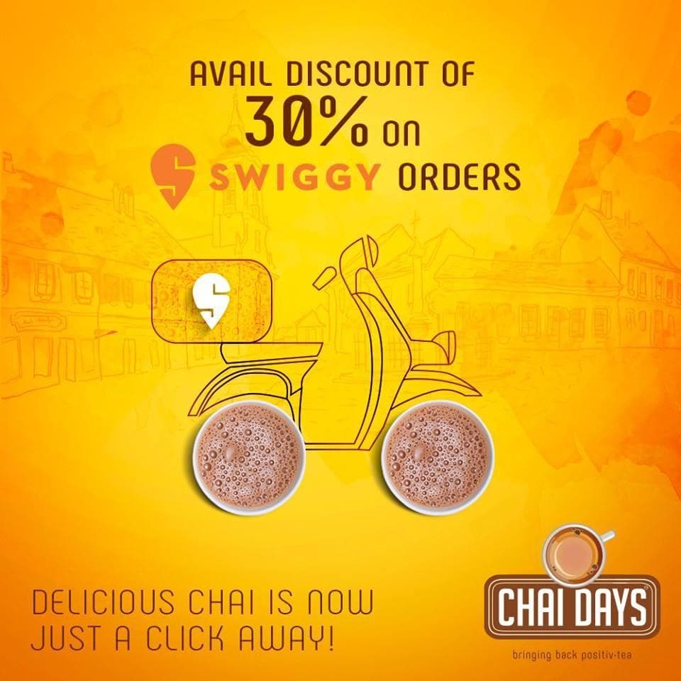 Orange creative with a line-drawn delivery scooter whose wheels are two cups of chai, with the text “Avail discount of 30% on Swiggy orders — Delicious chai is now just a click away!”