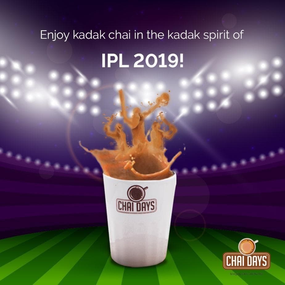 Floodlit stadium creative with chai splashing out of a Chai Days cup in the shape of cricketers, captioned “Enjoy kadak chai in the kadak spirit of IPL 2019!”