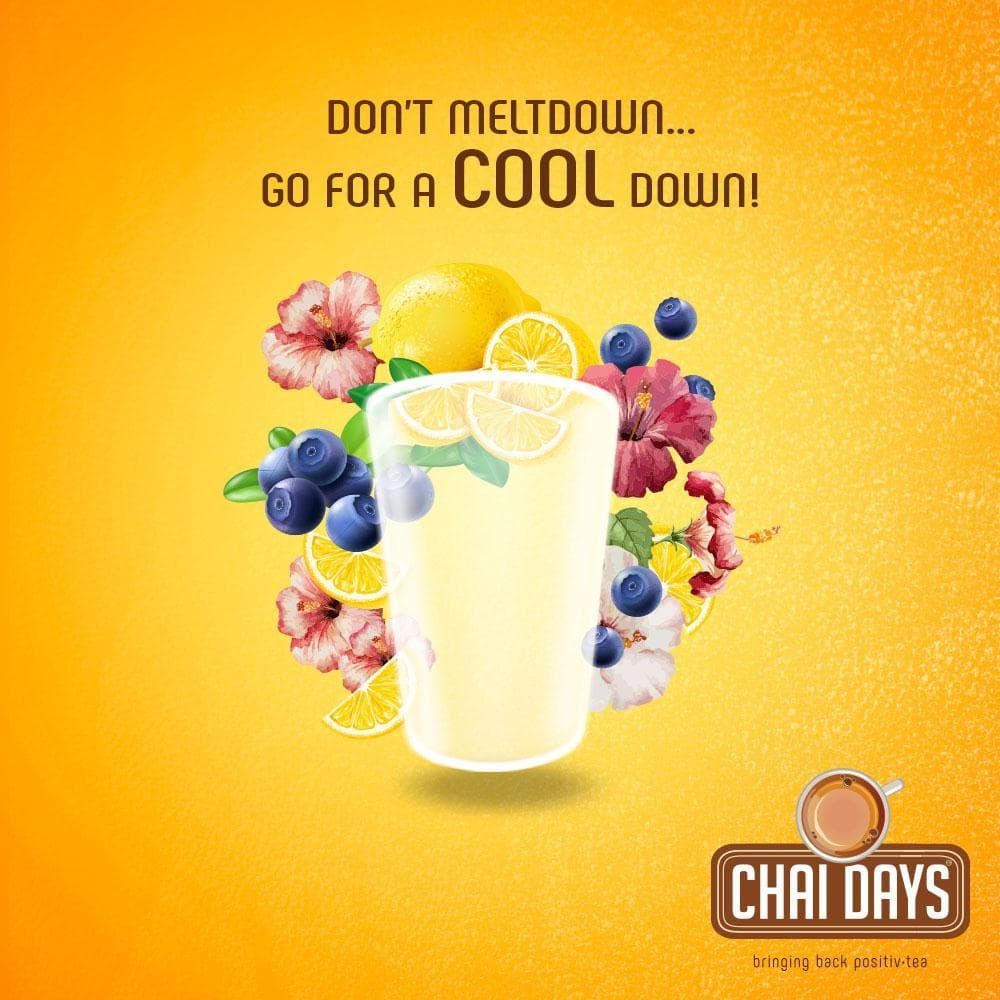 Orange creative with a glass surrounded by lemon slices, blueberries and hibiscus flowers and the line “Don’t meltdown… go for a cool down!”